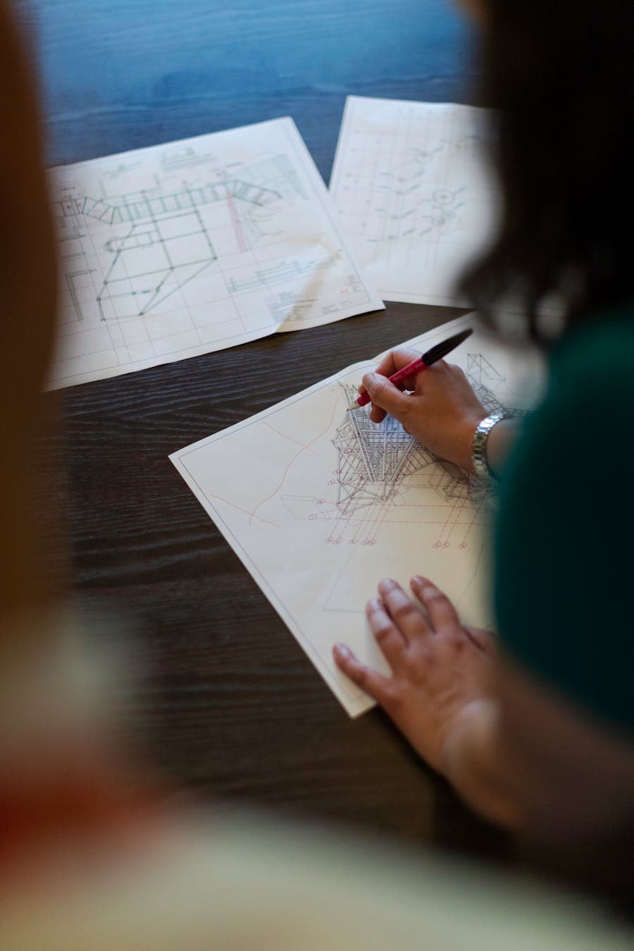 Engineer reviewing project blueprints — Vigo Burj
