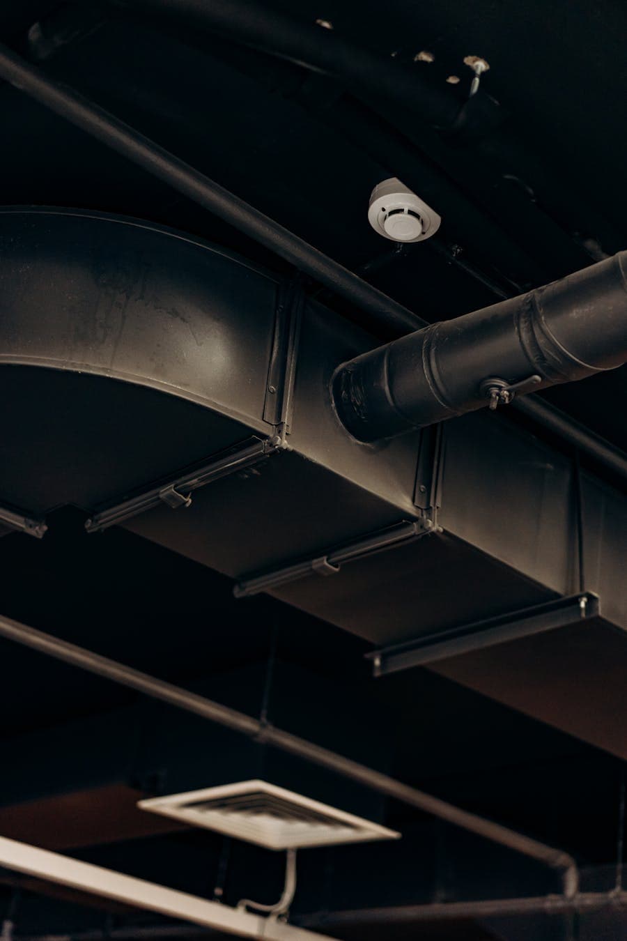 Mechanical pipework and ductwork installed in a commercial building